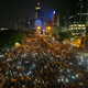 Protesters hold their mobile phones as they block the main street to the financial Central district, outside the government headquarters, in Hong Kong September 29, 2014.